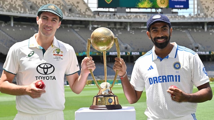 Bumrah Cummins with the BGT Trophy